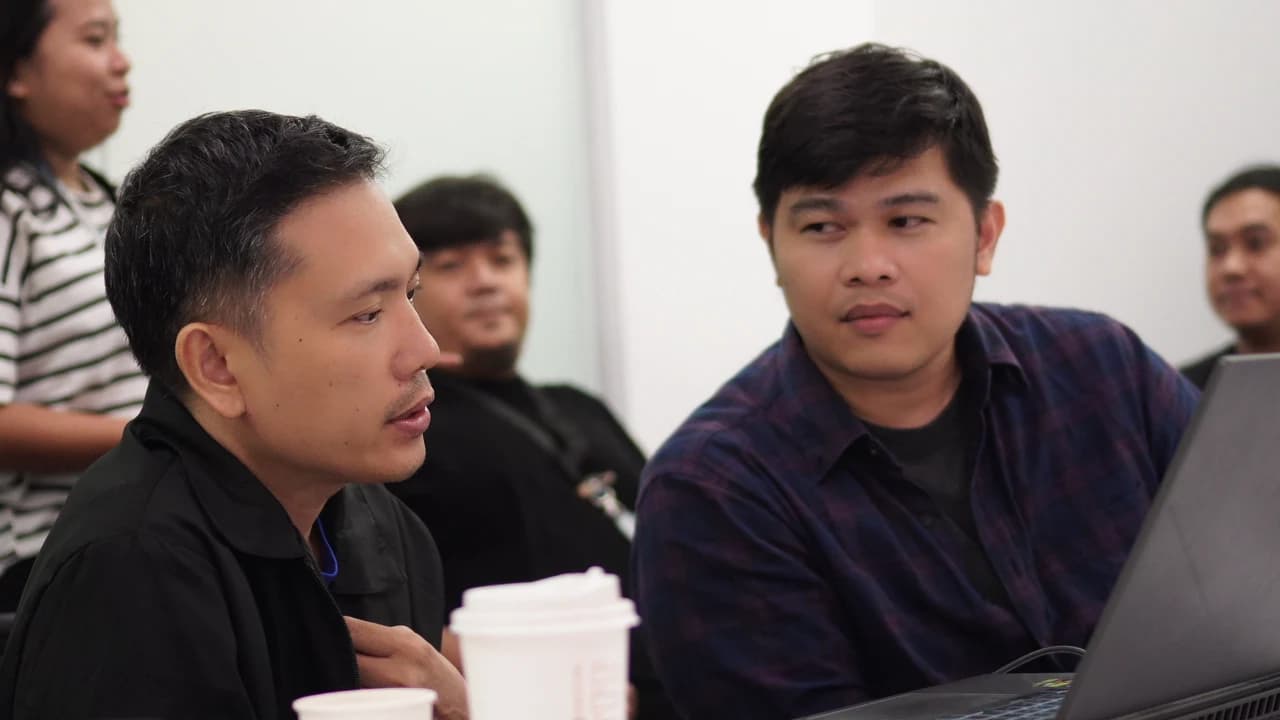 XIGNEX team briefing — CEO John Signe aligning with a client team